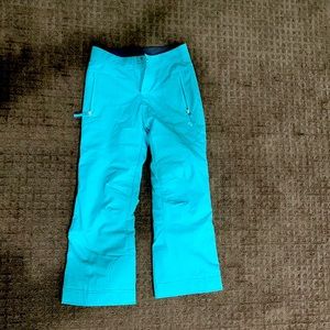 Blue Obermeyer kids ski pants.